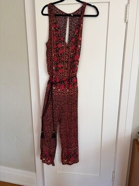 Free People Red Floral Sleeveless Jumpsuit with Tie Waist and Keyhole Back
